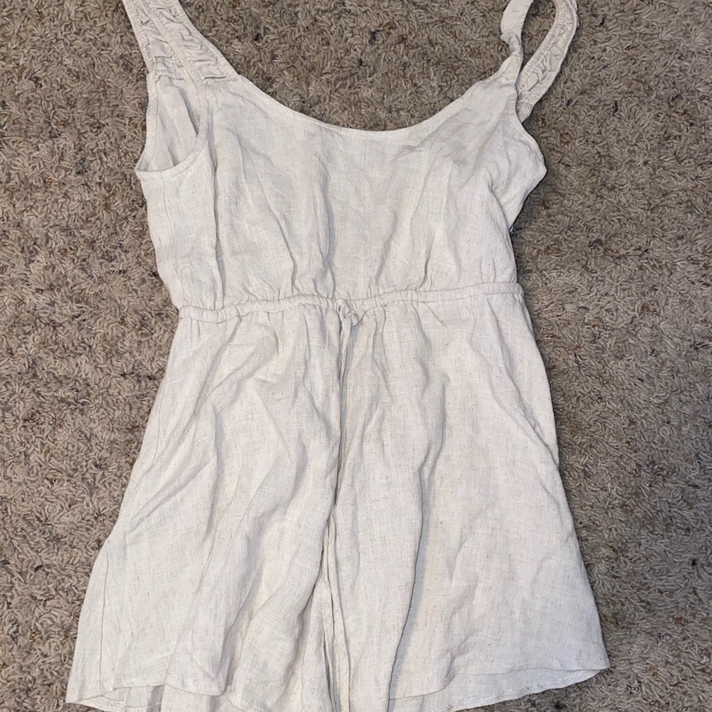 Beige colored romper from Princess Polly, tags on.